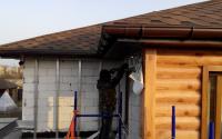 Отделка фасада металлическим блок-хаусом Suntile на частном доме